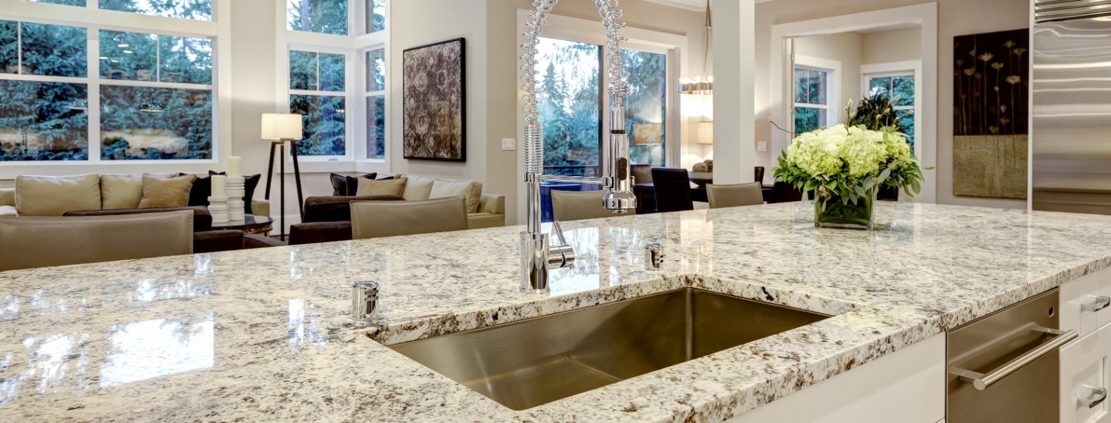 Custom kitchen with marble waterfall countertop