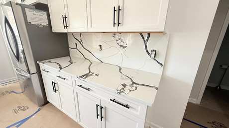 Dramatic veined quartz backsplash