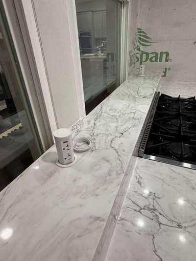 Gas range countertop with veined stone detail
