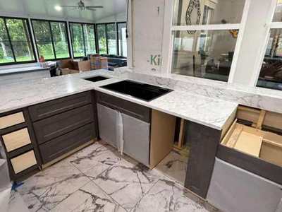Sink and counter installation with dark cabinets